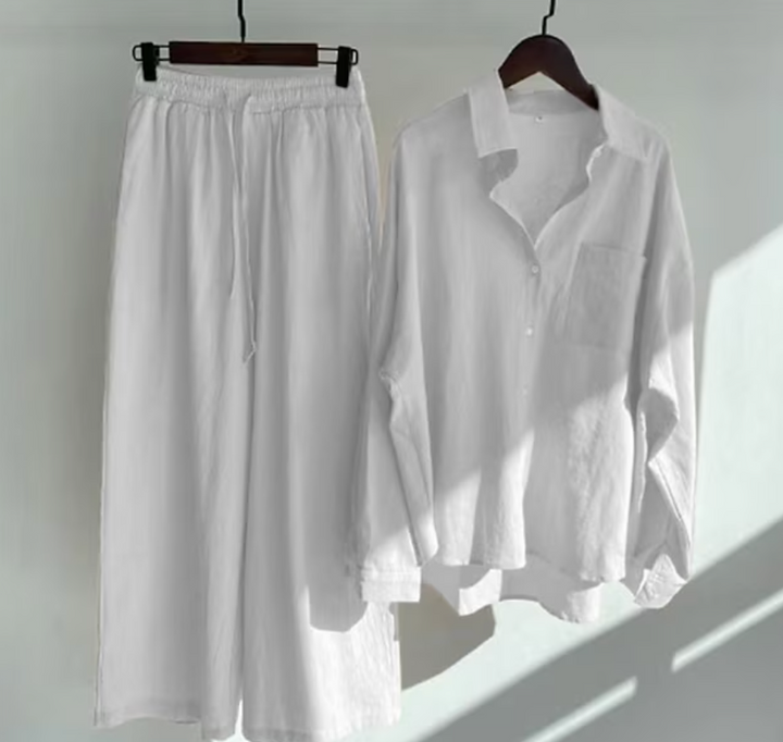 Chic women's two-piece set: long sleeve collared shirt and fluid wide-leg pants. Stylish and relaxed fit.