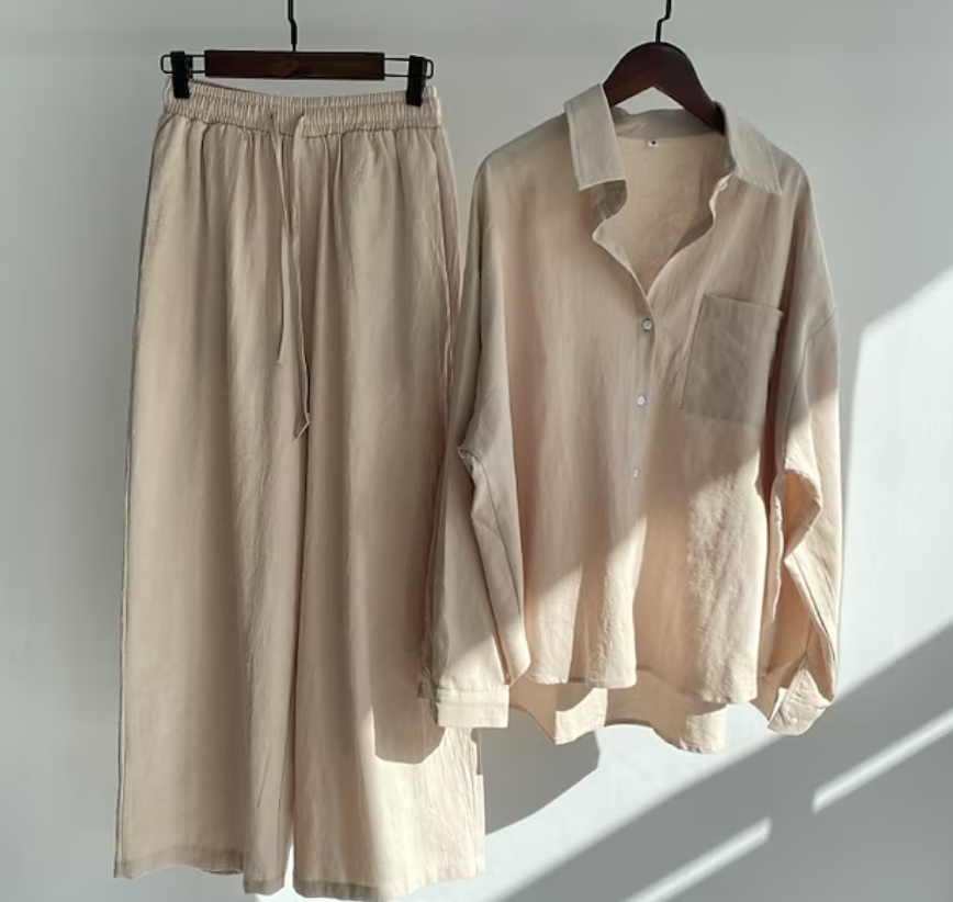 Relaxed fit women's two-piece collared shirt and fluid pants. Perfect for travel, casual, or office attire.