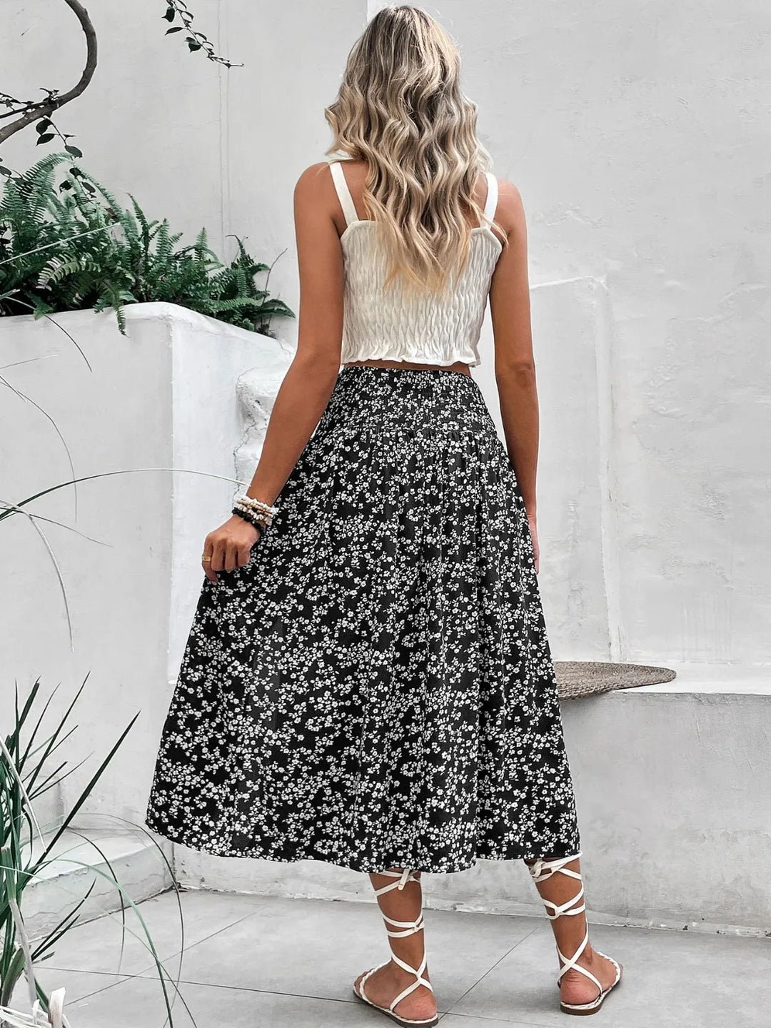 Women's printed summer midi skirt featuring a trendy slit and comfortable smocked waist detail.