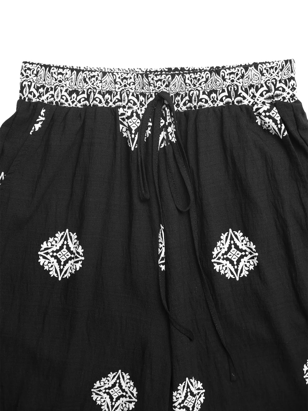 Stylish women's flowy pants in a vibrant boho pattern, featuring a wide leg and comfortable fit for any casual outing.