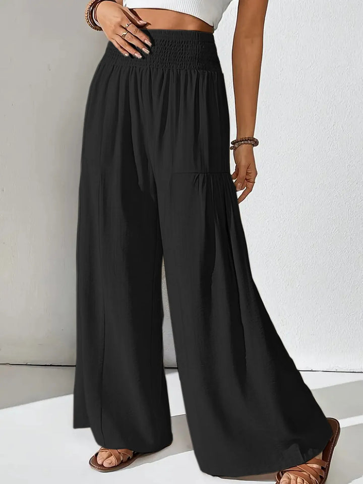 Stylish women's wide leg pants, smocked waist for a flowy, effortless casual fashion. Perfect summer travel.