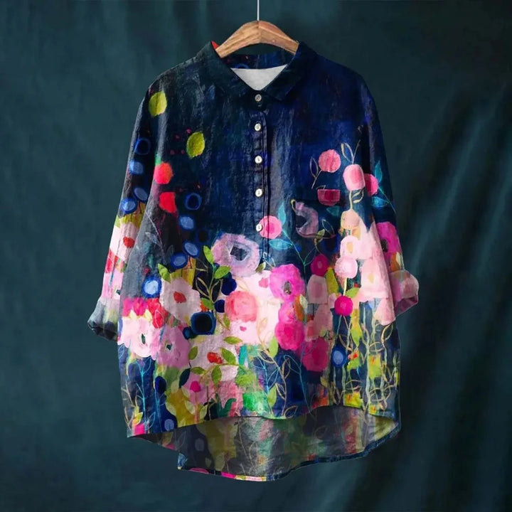 Blooming floral long-sleeve blouse for women. Vibrant print summer top, perfect for casual spring fashion.