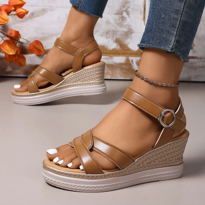 Elegant women's platform wedge sandals, offering comfortable height and open-toe design for summer fashion.