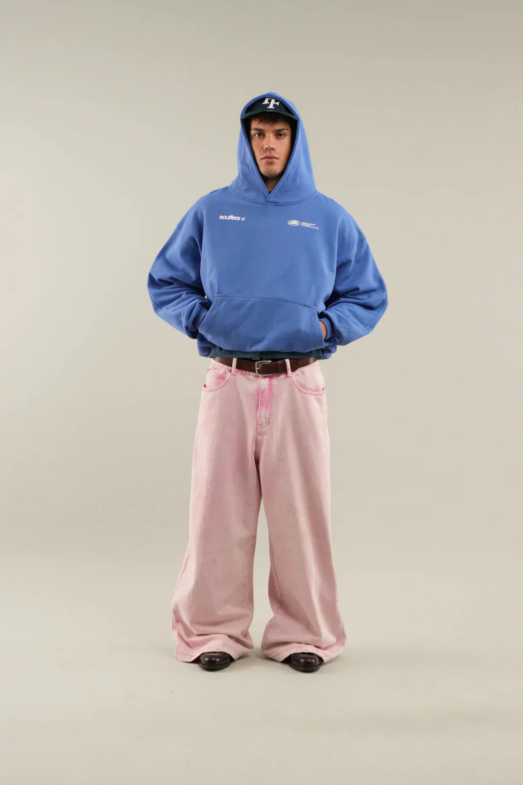 Soft pink unisex pullover hoodie for women & men, ideal for versatile casual styling.