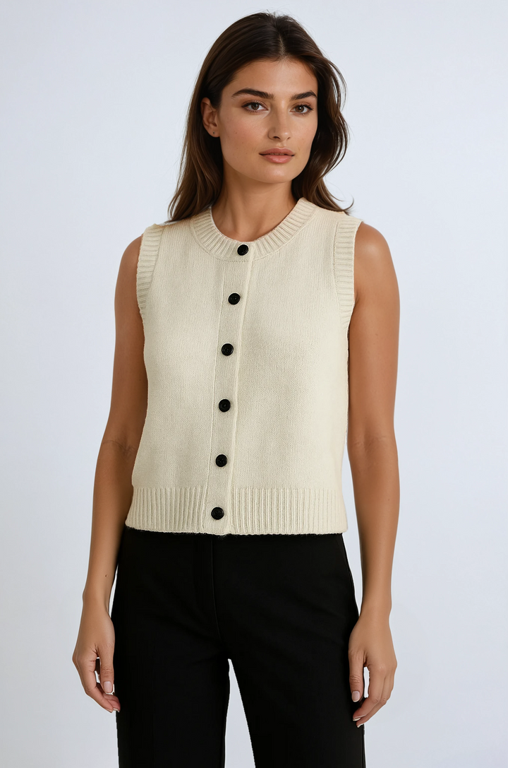 Women's chic apricot button-up sweater vest, perfect for effortless layering and modern transitional fashion.