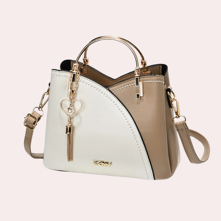 Women's versatile geometric shoulder bag, a modern handbag with unique angular design.