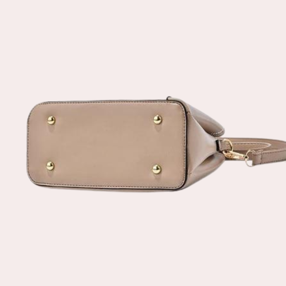 Blue geometric crossbody bag, a stylish women's purse with adjustable, removable shoulder strap.