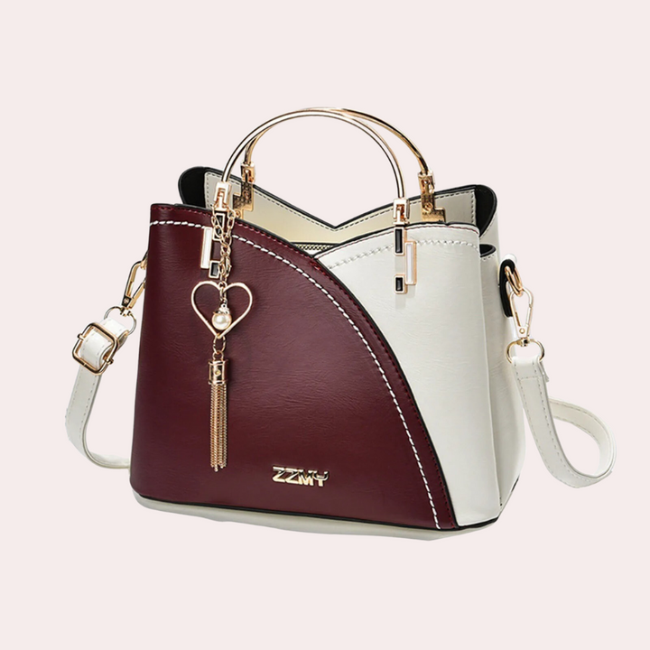 Modern geometric shoulder bag for women, a versatile purse with durable fabric & a unique shape.