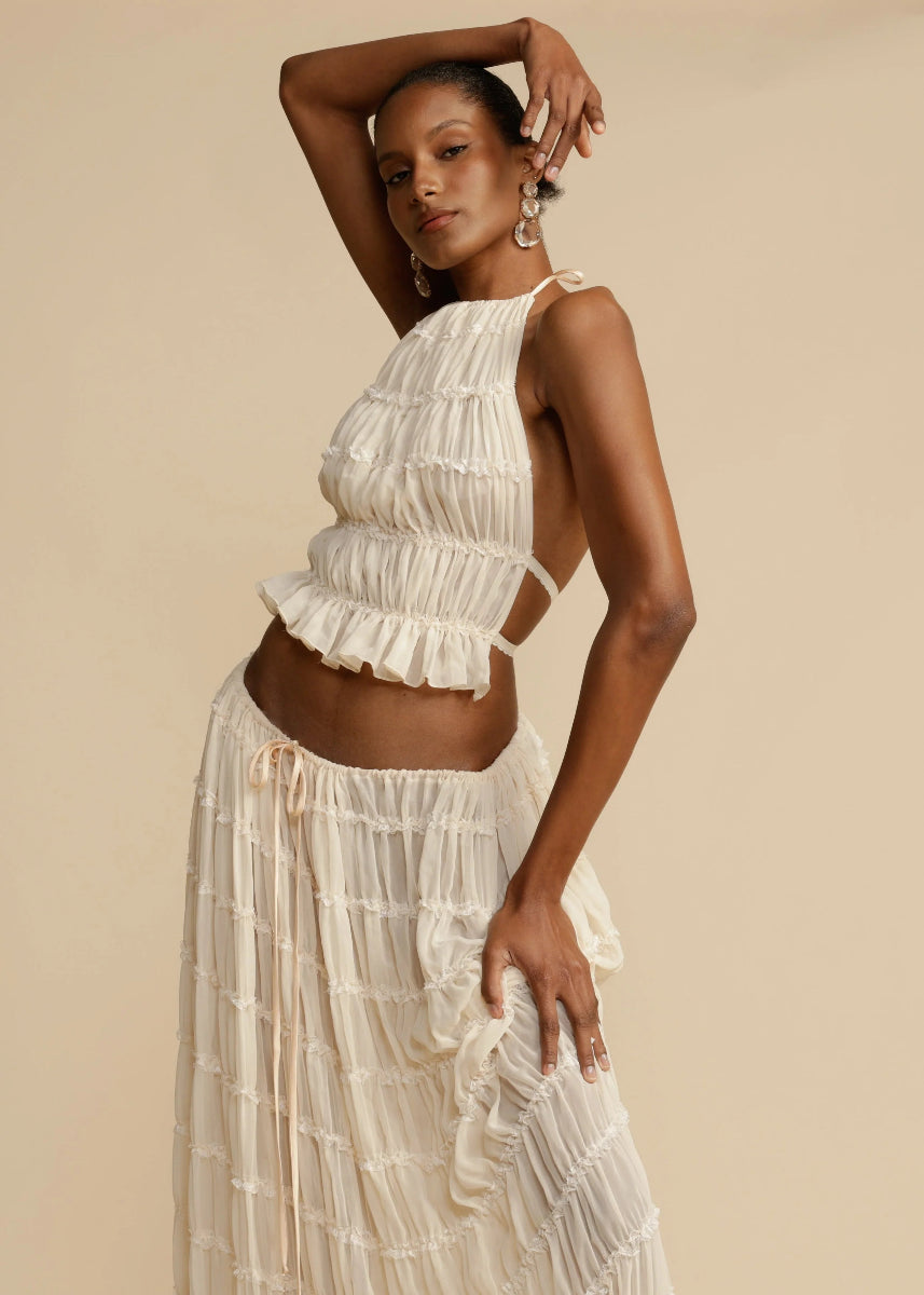 Breathable women's two-piece matching set: a chic halter top & long maxi skirt, perfect for resort wear.