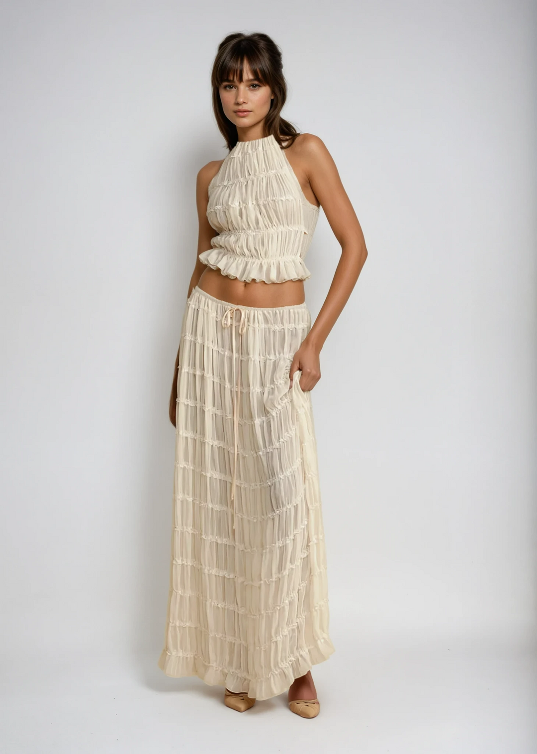 Women's lightweight two-piece summer set with a flowy halter top & matching maxi skirt, ideal for beachwear.