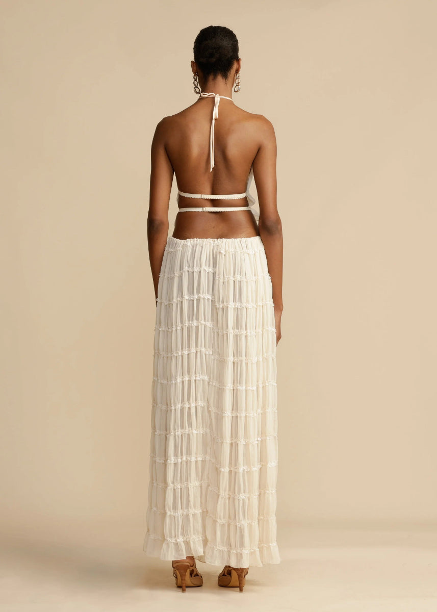 Lightweight women's two-piece set: a comfortable halter top & flowy maxi skirt, perfect for summer beach days.