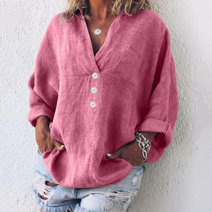 Women's relaxed fit V-neck button-down blouse, elegant and oversized. Versatile long sleeve top for casual or workwear.