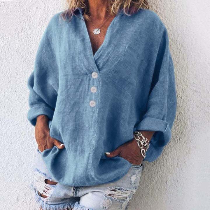 Sophisticated women's oversized V-neck blouse with button-down front. A timeless, relaxed fit top for casual & office.