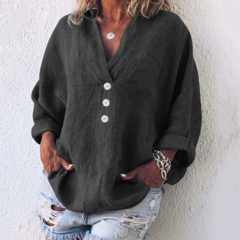 Elegant women's relaxed fit V-neck button-down blouse. Oversized long sleeve top for comfortable, stylish work or leisure.