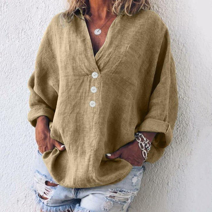 Timeless women's V-neck button-down blouse. Relaxed oversized fit, a sophisticated long sleeve top for any occasion.