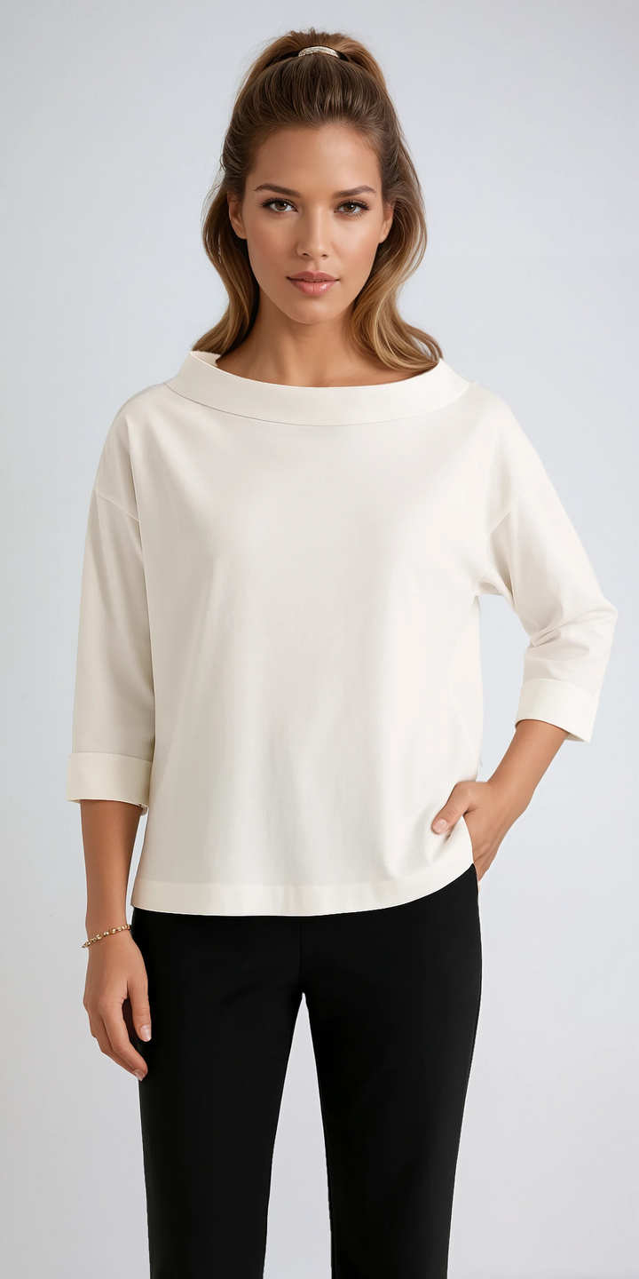 Women's relaxed fit boat neck top with 3/4 sleeves, perfect for casual or office wear. Comfortable and elegant.