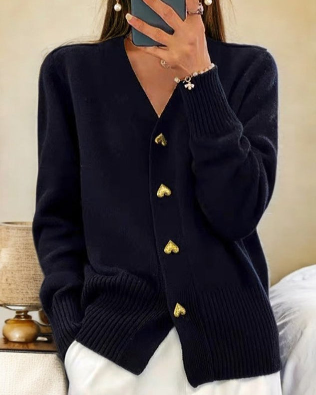 Full view of a woman wearing a chic V-neck button front cardigan, perfect for elegant casual fall outfits.
