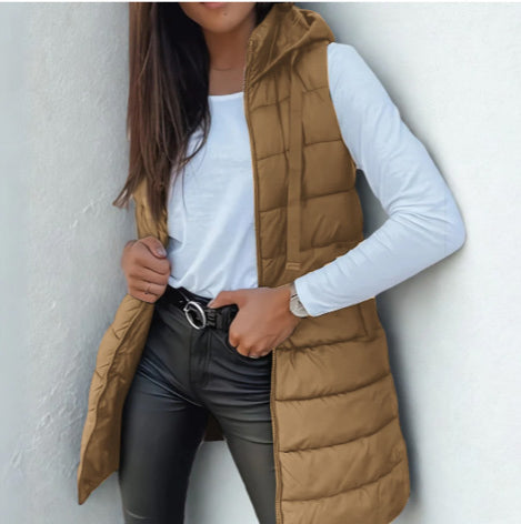 Stylish women's sleeveless long puffer vest with hood, perfect lightweight outerwear.