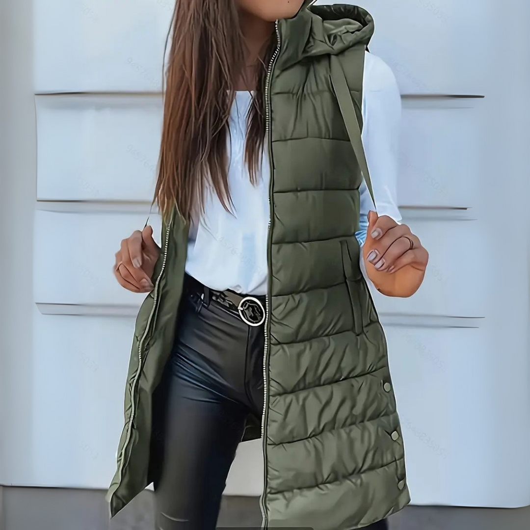 Versatile women's long puffer vest, hooded and sleeveless, comfortable lightweight outerwear.