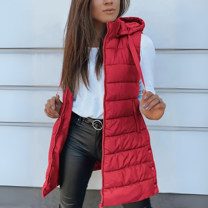 Soft women's lightweight long puffer vest with hood, essential casual outerwear for women.