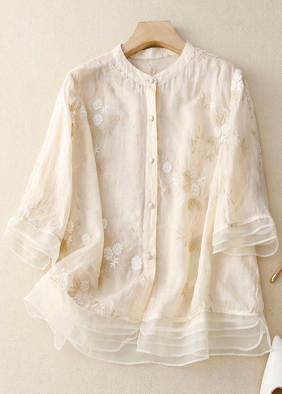 Stylish women's long sleeve floral embroidery sheer blouse. Versatile for casual or dressy spring/summer looks.
