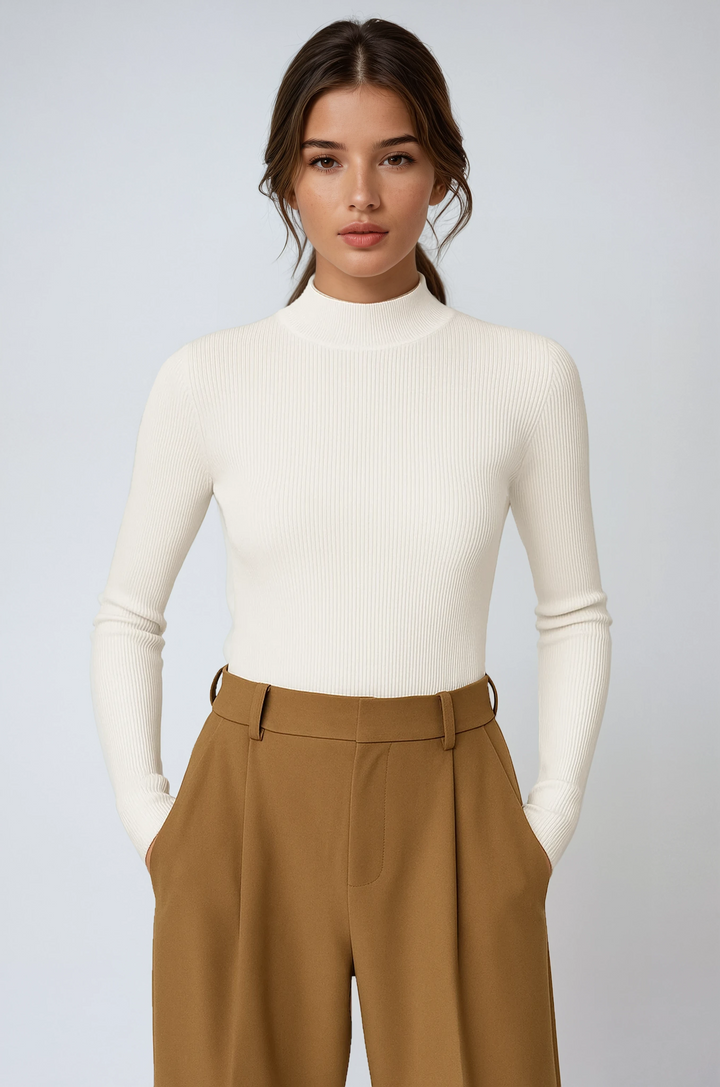 Women's ribbed high neck long sleeve top for versatile layering. Elegant and chic everyday fashion.