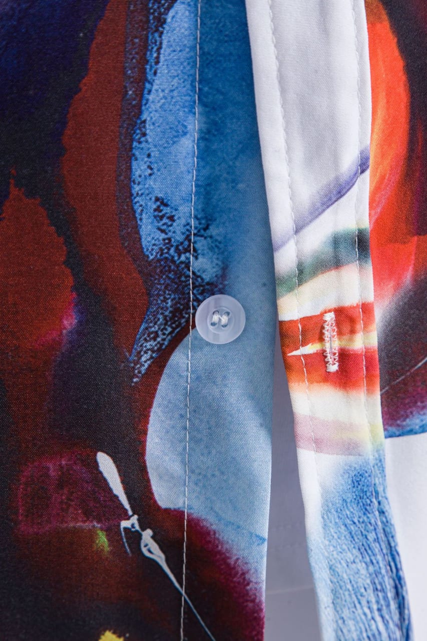 Relaxed fit men's tropical aloha shirt with a bright sunburst pattern, ideal for warm weather casual style.
