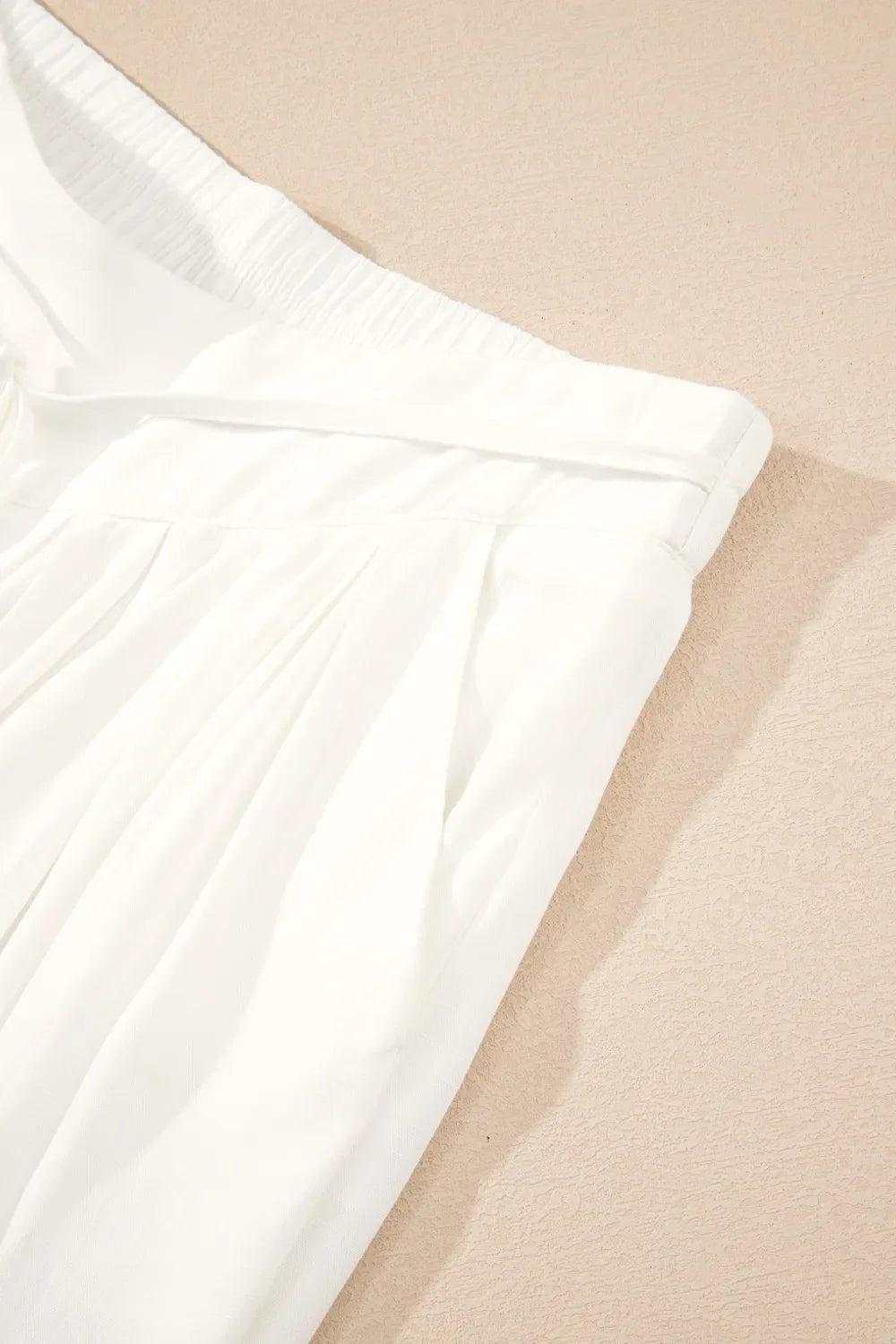 Full length: White wide leg drawstring pants for women, a must-have for effortless summer fashion.
