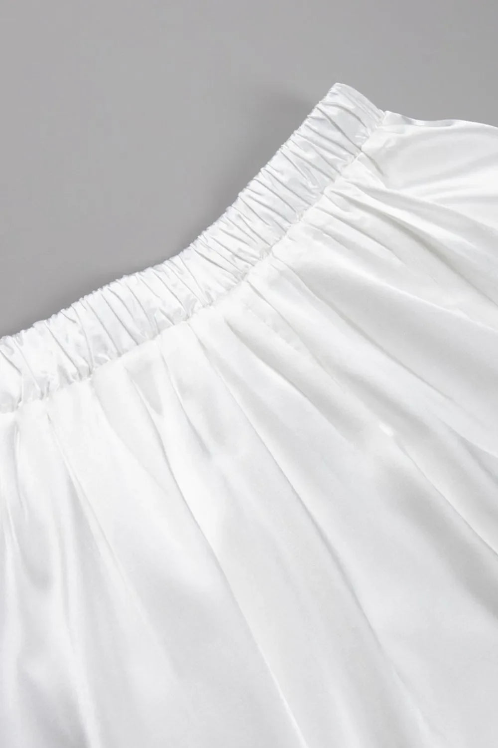 Long white women's maxi skirt, elegant & flowy. Versatile for office, evening events, and special occasions.