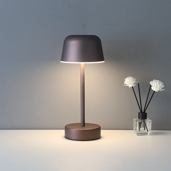 Versatile portable lamp, Nvroome, with a dimmable flare top, great for modern accent lighting.