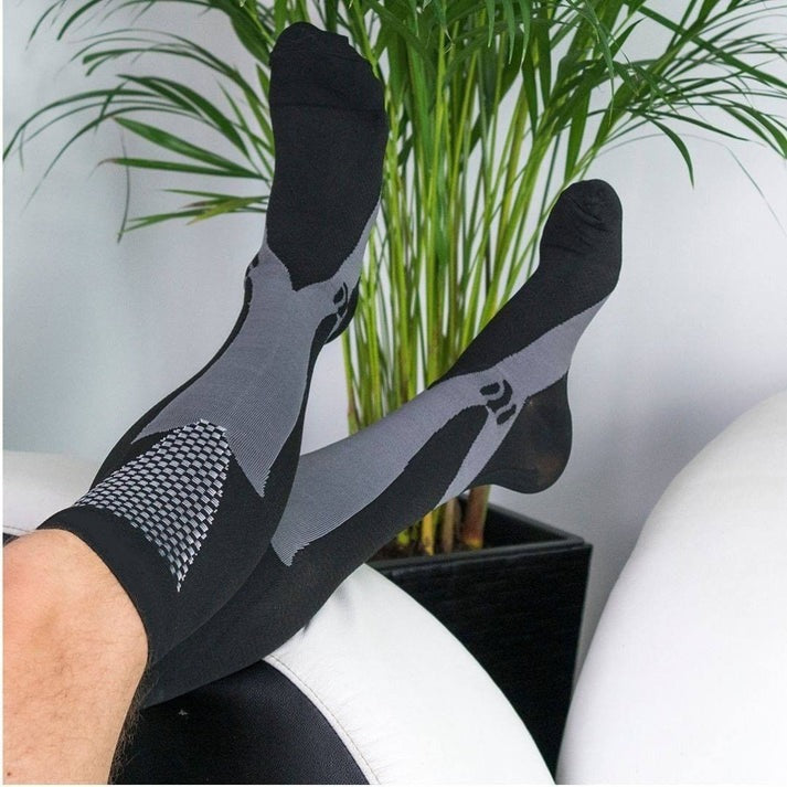 Comfortable compression socks for relief from plantar fasciitis, edema & varicose veins. All-day support.