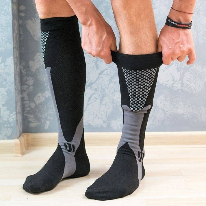 Unisex compression socks targeting plantar fasciitis pain & foot comfort. Essential for active lifestyles.