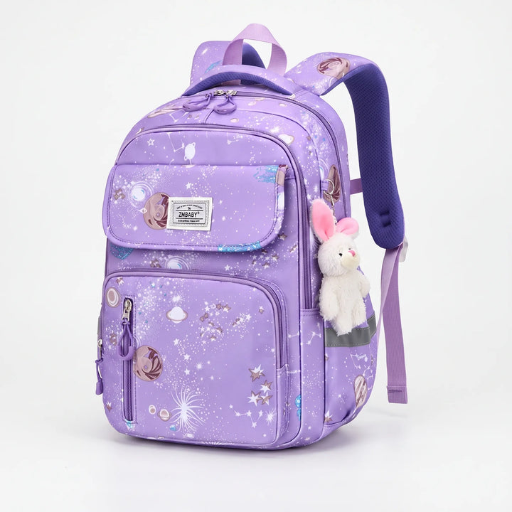 Child wearing a cosmic print school backpack, perfect for primary school. Durable, space-themed bag for kids.