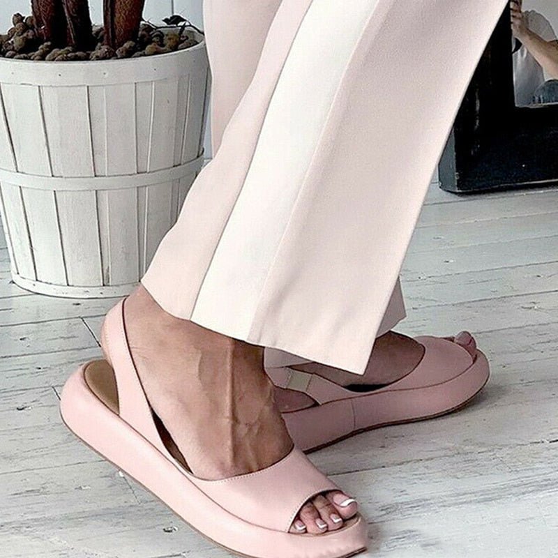 Versatile women's flat sandals with soft cushion sole and open toe for everyday comfort.