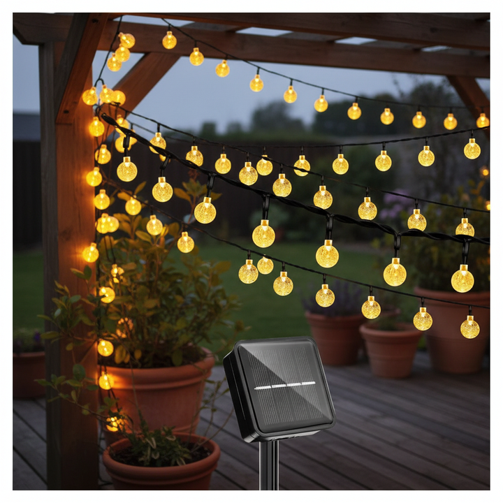 Weatherproof solar globe string lights illuminating a patio, creating a warm ambiance. Perfect for outdoor garden decor.