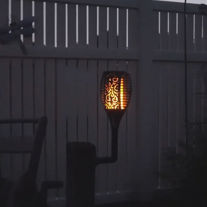 Vibrant solar LED flickering torch light, mimicking real flames. Great for outdoor living spaces & garden illumination.