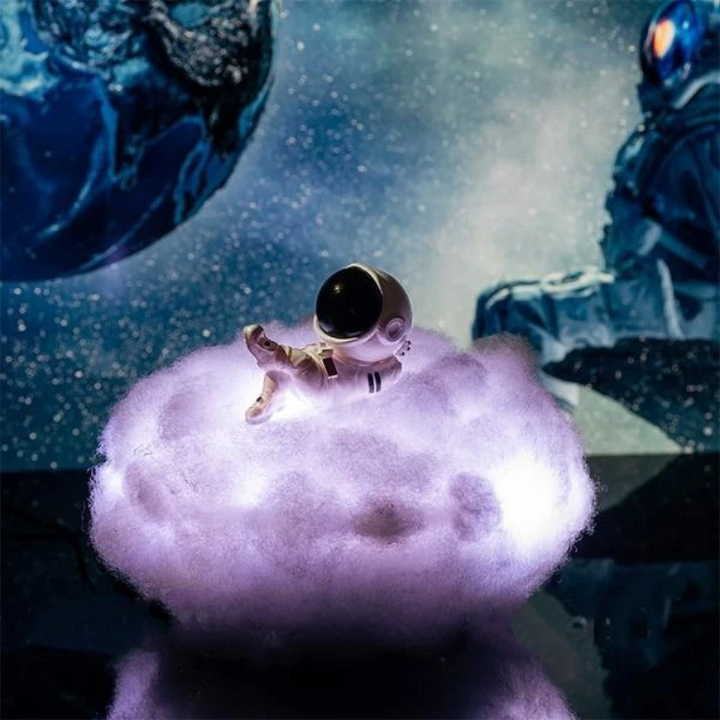 Enchanting Cloudrider astronaut lamp illuminates kids' rooms with a starry cloud night light. USB LED fun.
