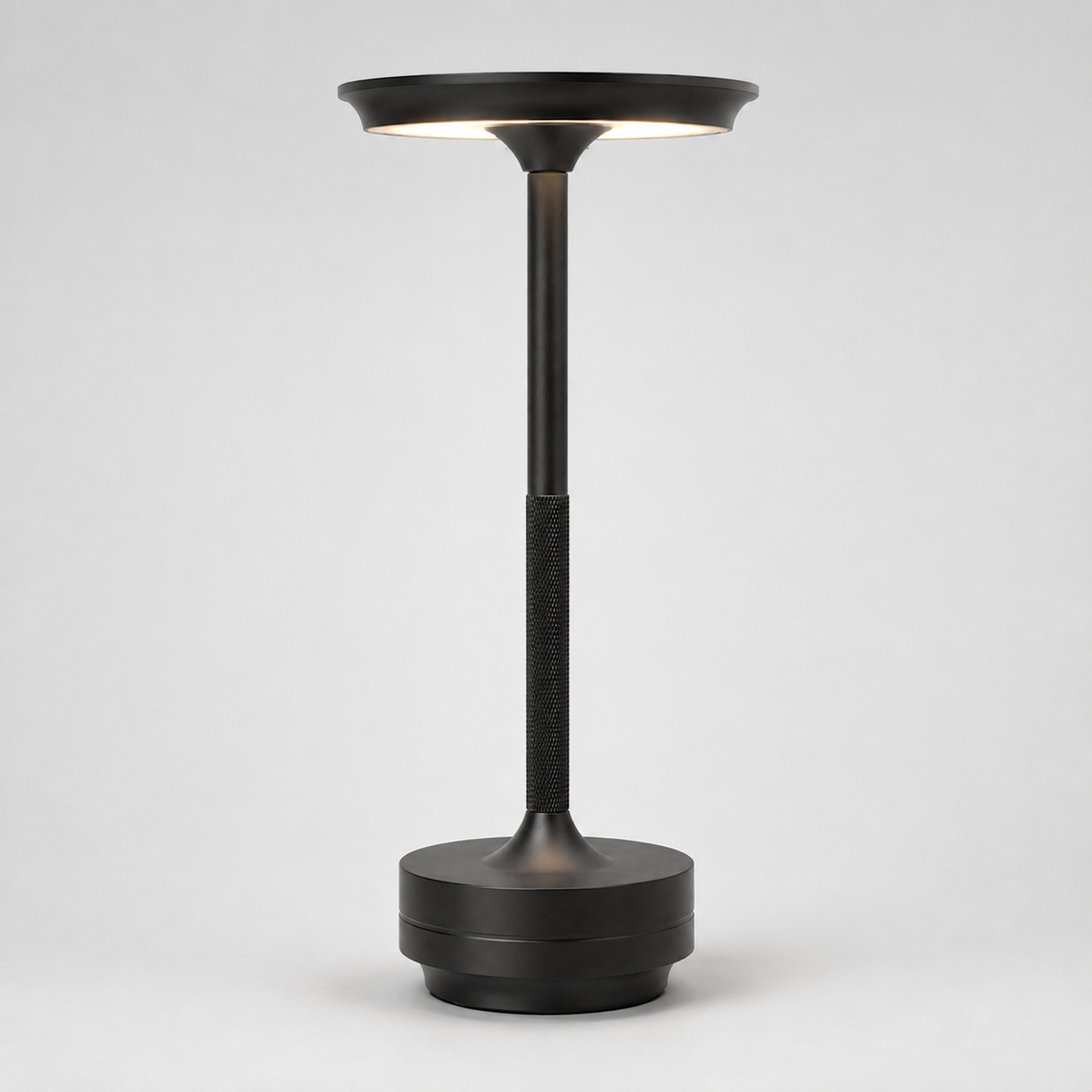 Contemporary metallic wireless table lamp, dimmable for desk or bedside, enhancing modern home decor.
