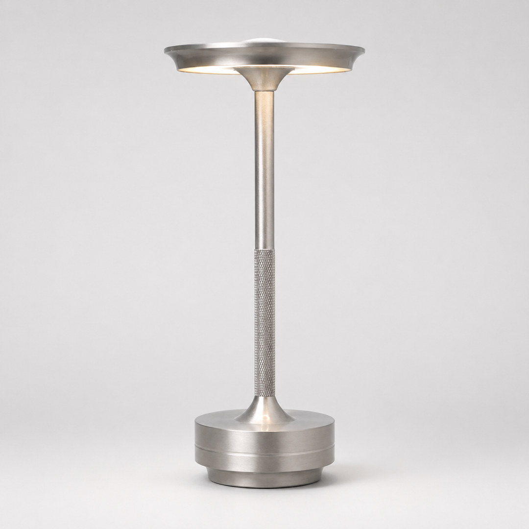 Sleek modern dimmable wireless table lamp with a metallic finish, ideal for stylish home or office.