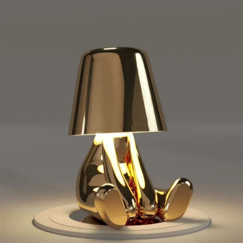 Ambient mood lighting from a dimmable LED figurine lamp, portable and rechargeable home decor.