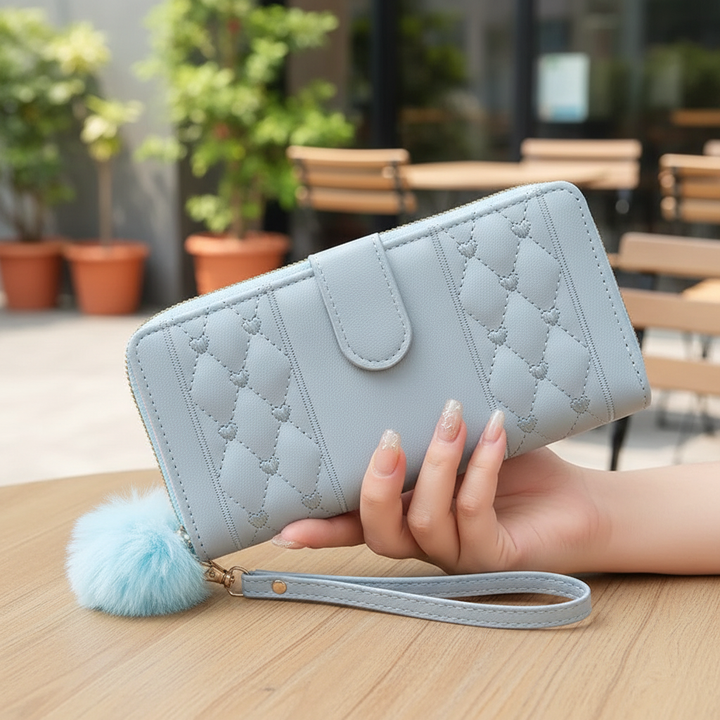 Women's long PU leather wallet with heart design, secure zipper, and multiple card holder slots.