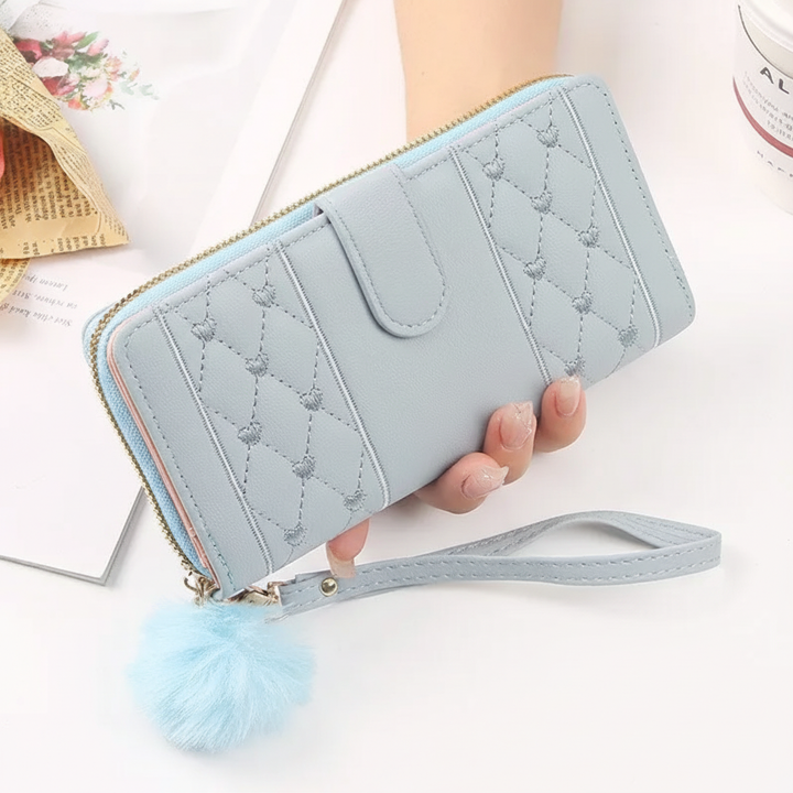 Stylish women's long wallet, PU leather, heart design, multi-card holder, and secure zipper closure. Elegant accessory.