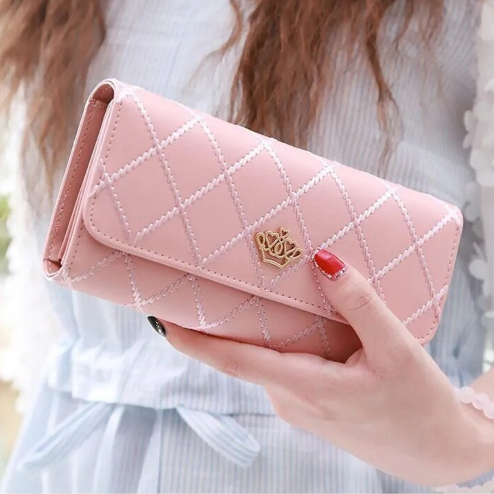Compact women's elegant tri-fold leather wallet, ideal for neatly carrying cards and cash.