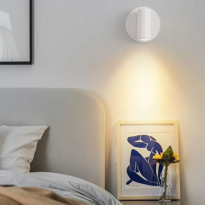Modern wireless LED spotlight for home decor. Rechargeable, dimmable accent light, stick-on design.