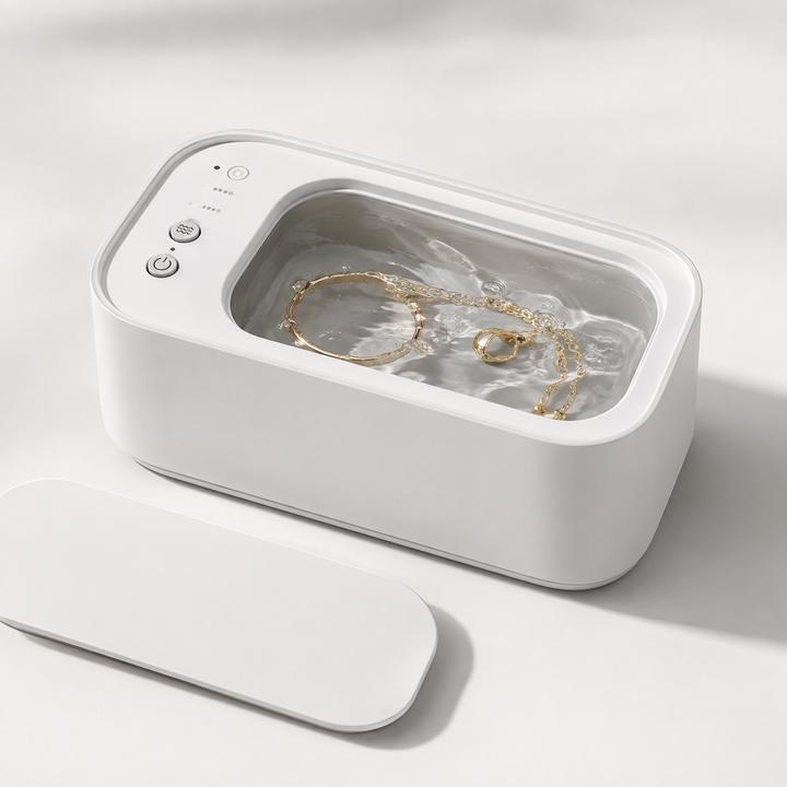 Compact ultrasonic jewelry & eyeglass cleaner, white. Ideal for gentle home cleaning.