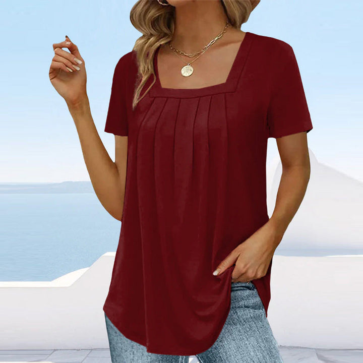 Chic women's fashion blouse, a sophisticated pleated top with a flattering square neck.