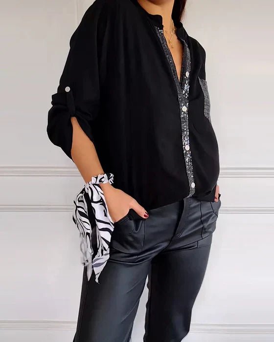 Versatile women's sequin top for casual glamour or elegant evening wear. Sparkle blouse with relaxed fit.