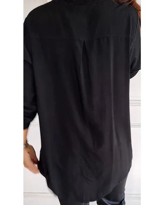 Chic women's sequin blouse with relaxed fit, offering sophisticated sparkle for versatile day-to-night fashion.