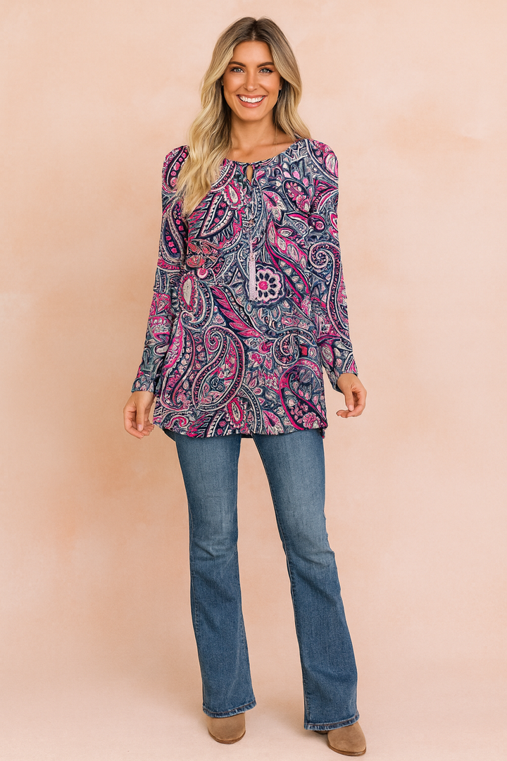 Stylish women's long-sleeve tunic sweater featuring a vibrant paisley print. Casual boho top for women.