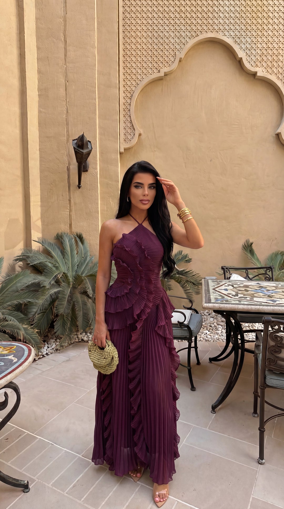 Fashion-forward women's halterneck ruffle maxi dress, showcasing an on-trend asymmetric hem.